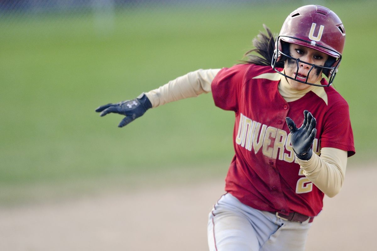 Ryelynn Mendoza heads for home plate, scoring one of the Titans’ 11 runs in a romp over North Central on Tuesday. (Tyler Tjomsland)