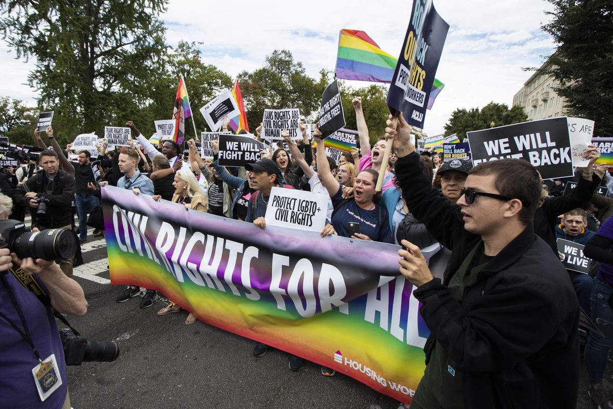 Supporters of LGBT rights stage a protest on the street in front of the U.S. Supreme Court, Tuesday, Oct. 8, 2019, in Washington. The Supreme Court heard arguments in its first cases on LGBT rights since the retirement of Justice Anthony Kennedy. (AP Photo/Manuel Balce Ceneta) ORG XMIT: DCMC120 (Manuel Balce Ceneta / AP)
