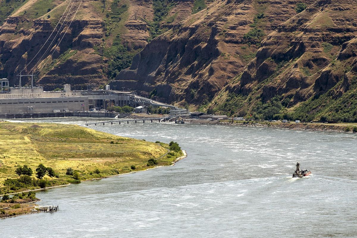 A boat makes its way up the Snake River toward the Lower Granite dam in Whitman and Garfield counties in this June 2018 file photo. A federal report released Friday advises against breaching the Lower Granite and three other dams on the Snake River, warning of high costs to replace lost electricity and effects to transportation. (Tribune/Pete Caster)