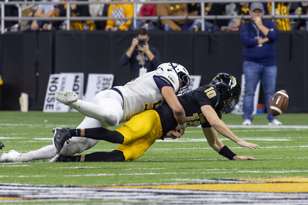 Idaho quarterback Jack Wagner (10) loses the ball while being sacked by Norther Colorado defensive lineman Dominic Butts (53) during Idaho’s homecoming game in the Kibbie Dome on Saturday, Oct. 11, 2025 in Moscow, Idaho.  (Iain Crimmins/For The Spokesman-Review)