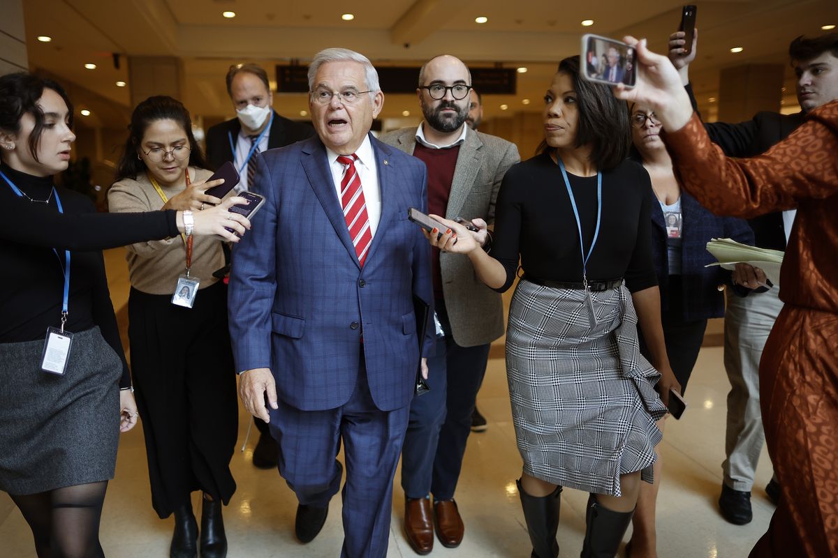 Above: Sen. Bob Menendez, D-N.J., talks to journalists Sept. 28 after addressing a closed Democratic caucus meeting at the U.S. Capitol in Washington, D.C. Left: Nadine Menendez, left, wife of Sen. Bob Menendez, arrives Oct. 2 at Manhattan Federal Court in New York City.  (Chip Somodevilla)