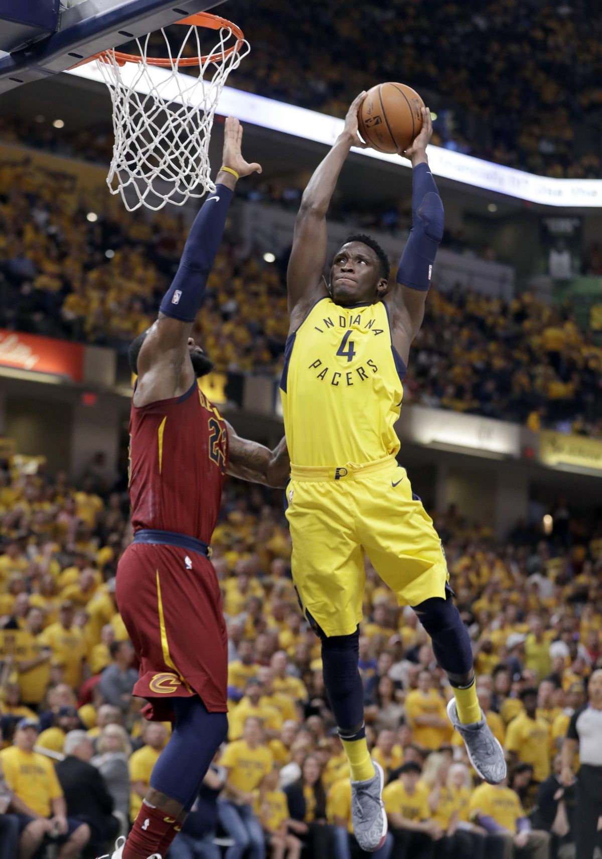 Indiana Pacers’ Victor Oladipo (4) heads to the basket past Cleveland Cavaliers’ LeBron James during the second half of Game 6 of a first-round NBA basketball playoff series, Friday, April 27, 2018, in Indianapolis. (Darron Cummings / Associated Press)