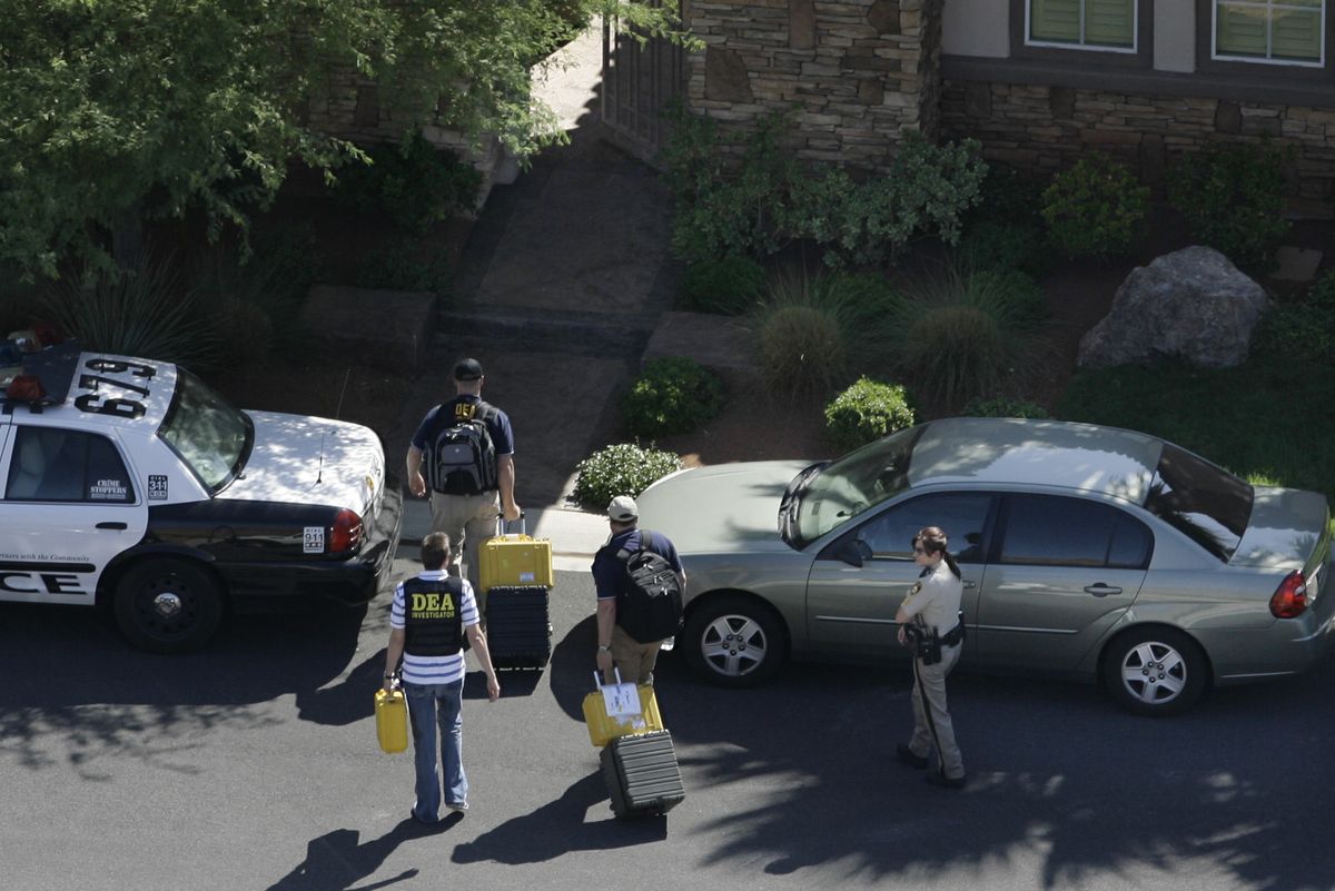 Investigators search the home of Michael Jackson’s physician, Dr. Conrad Murray, in Las Vegas on Tuesday.  (Associated Press / The Spokesman-Review)