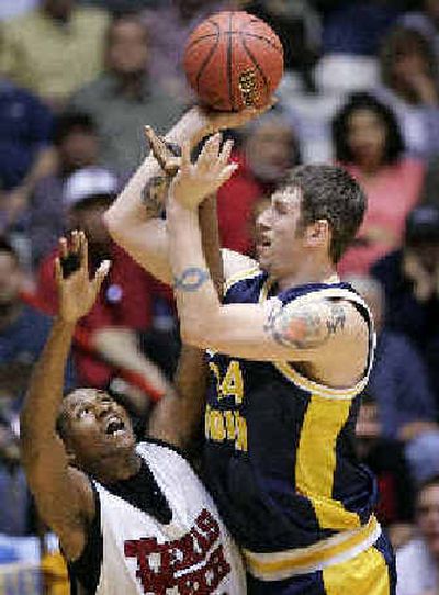 
West Virginia's Kevin Pittsnogle, right, shoots over Texas Tech's Darryl Dora in the second half. 
 (Associated Press / The Spokesman-Review)