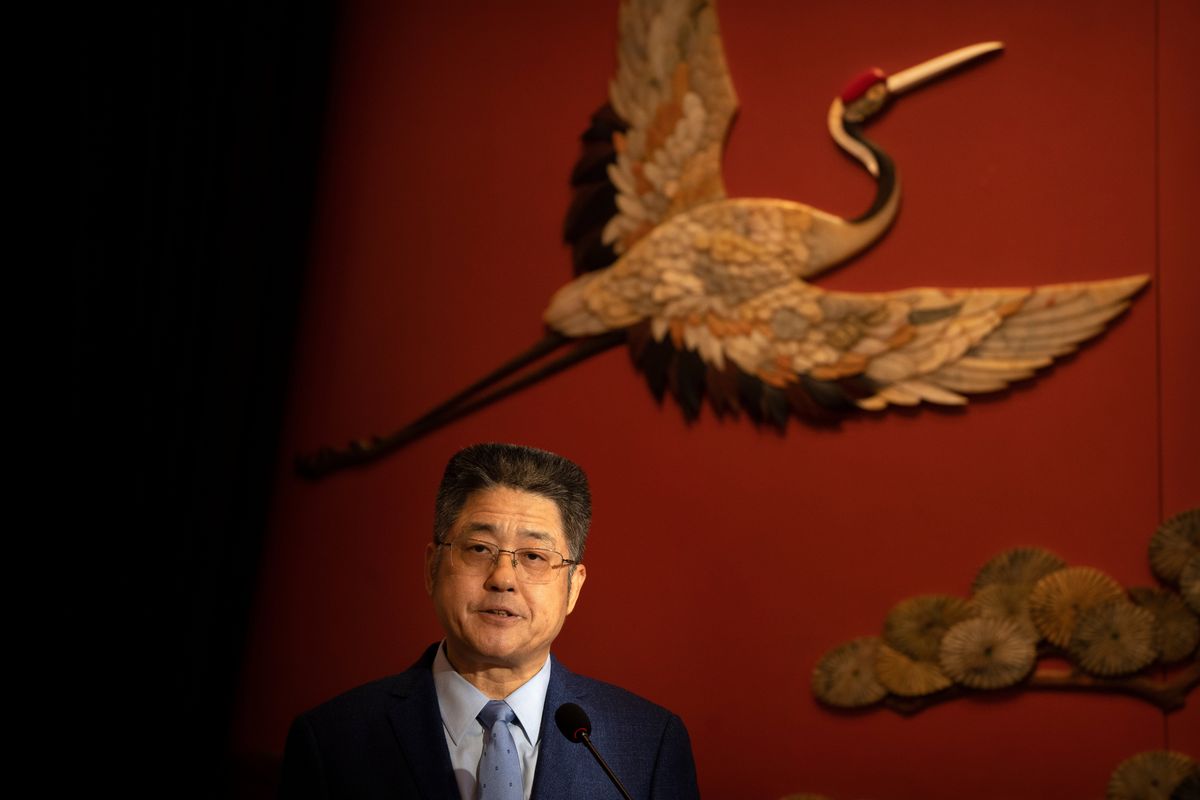 Chinese Vice Foreign Minister Le Yucheng speaks at a forum with experts arranged for foreign journalists in Beijing, Thursday, Dec. 2, 2021. China and the United States are tussling over President Joe Biden