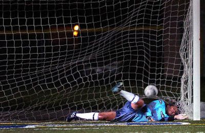 
Gonzaga Prep junior goalkeeper Elise Kuhar-Pitters fails to stop a Richland shot during Tuesday night's shootout. 
 (Jed Conklin / The Spokesman-Review)