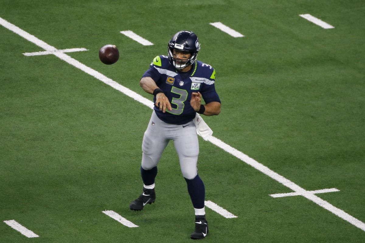 Seattle Seahawks quarterback Russell Wilson  throws a pass during an NFC wild-card game against the Dallas Cowboys in Arlington, Texas, on  Jan. 5. (Roger Steinman / AP)