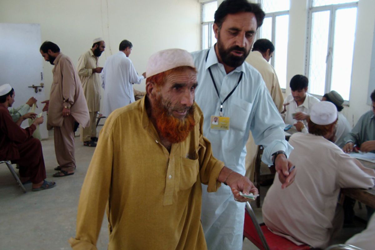 Pakistani tribal people, who left their villages in South Waziristan due to military offensive,  register for relief aid in Dera Ismail Khan on Saturday.  (Associated Press / The Spokesman-Review)