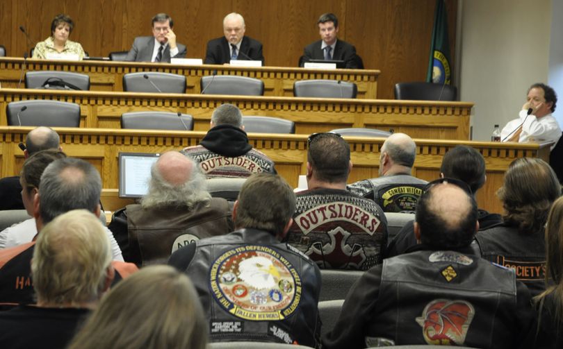 OLYMPIA -- Motorcyclists lobby the Senate Transportation Committee in support of a bill that would let them ride without helmets. (Jim Camden)