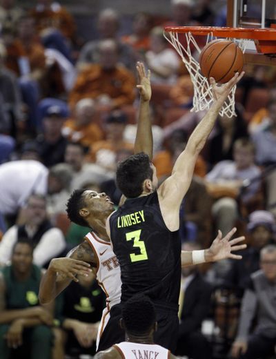 Baylor guard Jake Lindsey (3) lays up the ball against Texas guard Kerwin Roach during the Bears’ win on Saturday. (Michael Thomas / Associated Press)