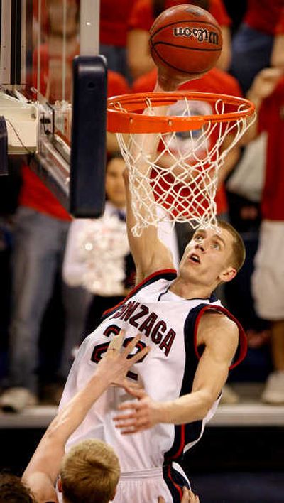 
S-R file photo Zags' Micah Downs takes it to Pilots in last year's game at GU.
 (S-R file photo / The Spokesman-Review)