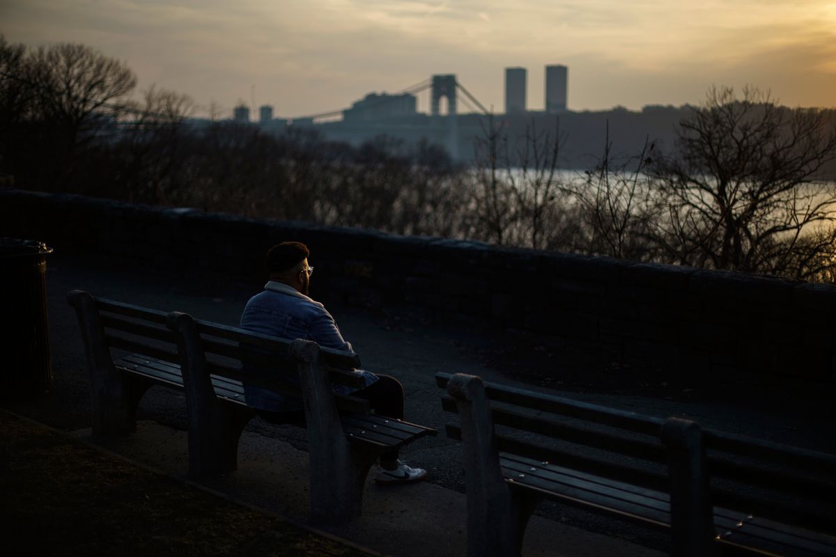 Adam Almonte sits on a bench overlooking the Hudson River where he used to sit and eat tuna sandwiches with his older brother, Fernando Morales, in Fort Tryon Park in New York, Wednesday, March 16, 2022. On the deadliest day of a horrific week in April 2020, COVID-19 took the lives of 816 people in New York City alone. Lost in the blizzard of pandemic data that's been swirling ever since is the fact that 43-year-old Morales was one of them. Soon, likely in the next few weeks, the U.S. toll from the coronavirus will surpass 1 million.  (David Goldman)