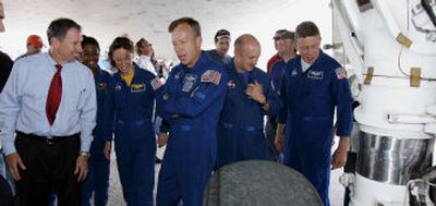 
NASA Administrator Michael Griffin, left, talks with STS-121 Commander Steven Lindsey, center, in Cape Canaveral, Fla., on Monday. Also pictured, from left, are mission specialists Stephanie Wilson and Lisa Nowak,  pilot Mark Kelly and mission specialist Michael Fossum. 
 (Associated Press / The Spokesman-Review)