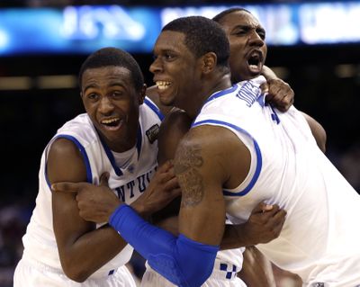 Doron Lamb (left), Terrence Jones and Marquis Teague celebrate after Kentucky captured the NCAA championship on Monday night. (Associated Press)