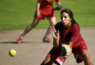 
Second baseman Lexi Obenchain  catches a hit during slowpitch softball practice at University High School Monday. Last year, U-Hi won the district and league titles.
 (Holly Pickett / The Spokesman-Review)