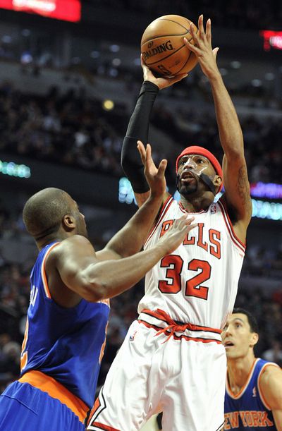 Chicago’s Richard Hamilton shoots over New York’s Raymond Felton during the second half of the Bulls win. (Associated Press)