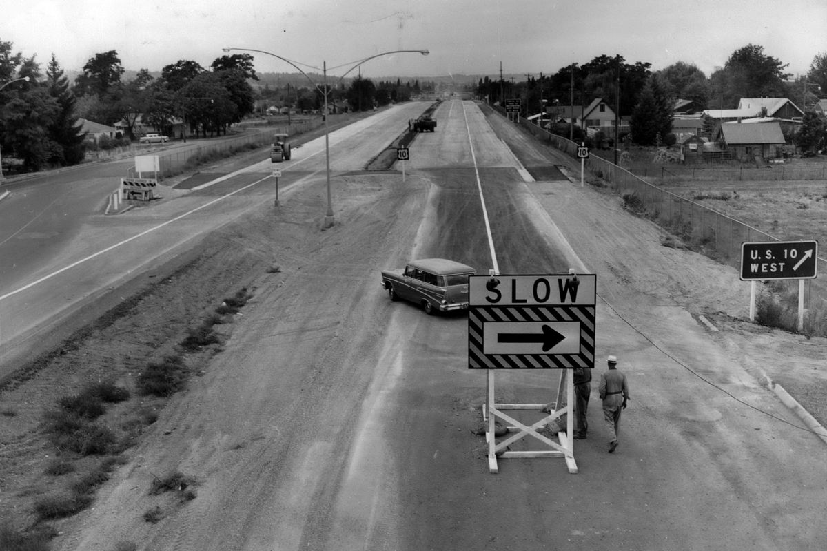 1958: A 2.04-mile extension, from Custer Road to Helena Street, would bring the modern Spokane Valley freeway into Spokane. Prior to that, drivers heading into Spokane had to detour onto U.S. Highway 10, following Sprague Avenue, then onto Second and Third avenues downtown. This photo looks west from the pedestrian overpass crossing at Custer where the new section joins the freeway.  (The Spokesman-Review Photo Archive)