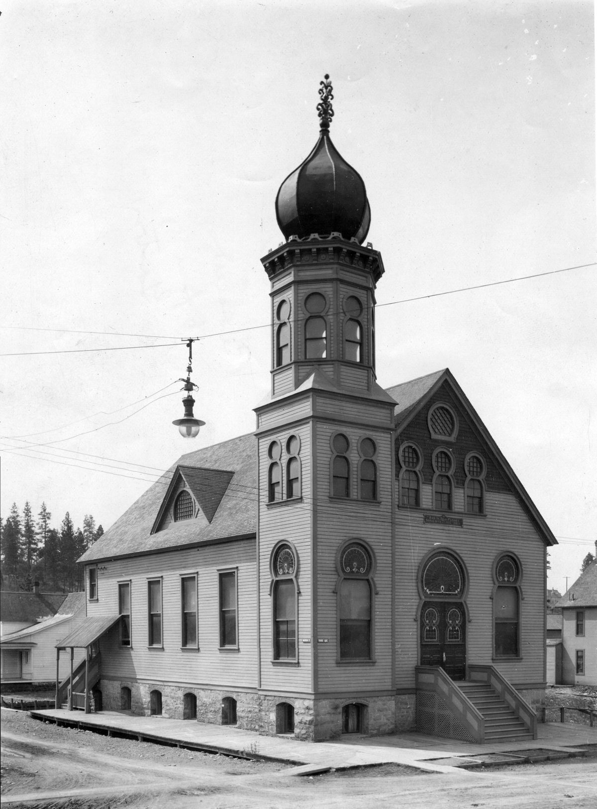 Temple Emanuel, built in 1892 by Herman Preusse, was the first Jewish synagogue built in the state of Washington. It was a frame structure with stone foundation, and was dedicated at Third Avenue and Madison Street, just four days before Seattle opened its first synagogue. Temple Emanuel stood until 1934, and a plaque commemorating its significance now stands in place by the wall of the car dealership that now occupies that location. (The Spokesman Review)