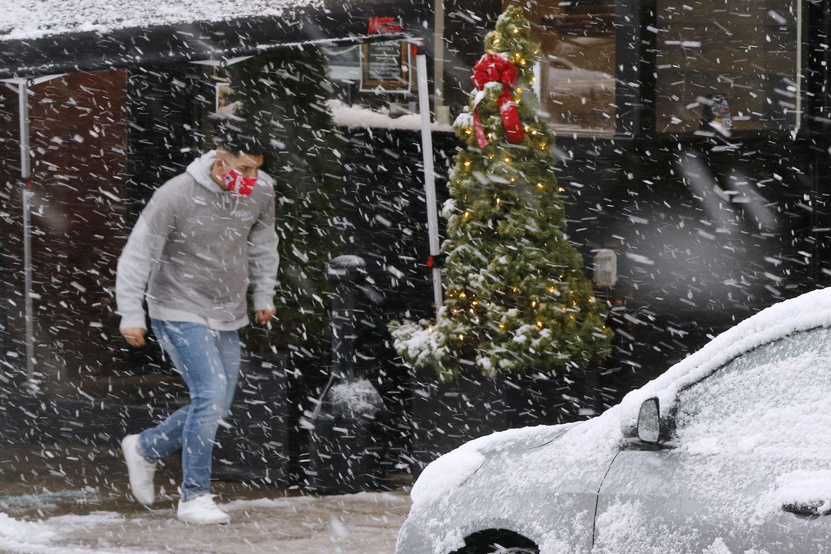 A man runs through heavy snow on Saturday downtown in Marlborough, Mass.  (Bill Sikes)