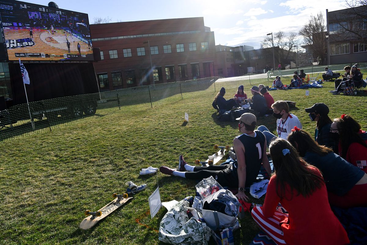 Gonzaga students wait for tipoff during Tent City: The Remix, a socially distant Kennel Club watch party of Gonzaga