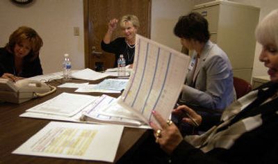 
Middle, Central Valley School District Assistant Superintendent Lise Louer, snaps her fingers as the numbers come together in a meeting at the Central Valley School District office Aug. 31. Also around the table are, from left, Learning and Teaching Executive Director Terrie Vanderwegen, Central Valley School District Executive Director Jean Marczynski and Central Valley School District Executive Director Carol Peterson. 
 (Liz Kishimoto / The Spokesman-Review)