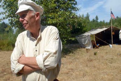 
John Gren, who has attended most of the 18 rendezvous events at the Cataldo Mission, stands in front of his tent at the annual gathering Saturday. He is afraid he is part of the last generation of enthusiasts re-creating the era of 1810-1830 in the Inland Northwest, noting the lack of younger people participating in the event. 
 (Photos by JESSE TINSLEY / The Spokesman-Review)