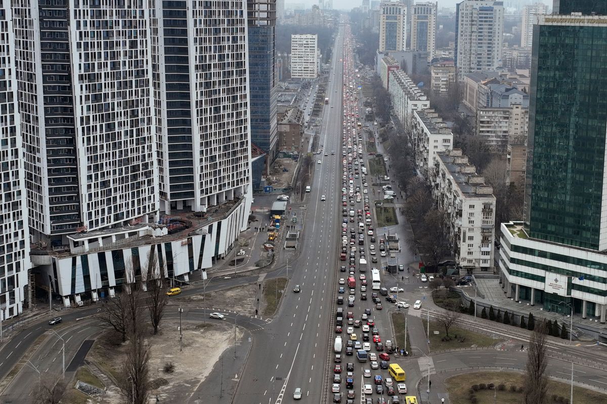 Traffic jams are seen as people leave the city of Kyiv, Ukraine, Thursday, Feb. 24, 2022. Russian President Vladimir Putin on Thursday announced a military operation in Ukraine and warned other countries that any attempt to interfere with the Russian action would lead to "consequences you have never seen."  (Emilio Morenatti)