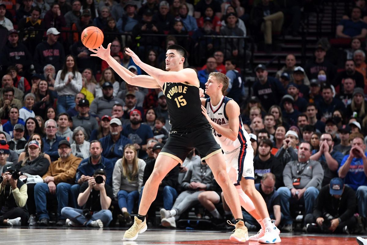 Gonzaga’s Ben Gregg, right, leans into Purdue’s 7-foot-four-inch Zach Edey to try and deny him freedom of movement but Edey continued to score at will through the second round game between Gonzaga and Purdue Friday, Nov. 25, 2022 at the Moda Center in Portland Oregon to earn a spot in Sunday’s championship in the Phil Knight Legacy tournament Sunday.  (Jesse Tinsley / The Spokesman-Review)