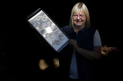 
Donna Halvorson displays an aluminum serving platter. Halvorson has collected aluminum for 15 years. 
 (Brian Plonka / The Spokesman-Review)