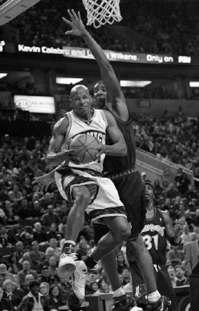 
Seattle's Ray Allen drives to the basket as Minnesota's Mark Blount defends. 
 (Associated Press / The Spokesman-Review)