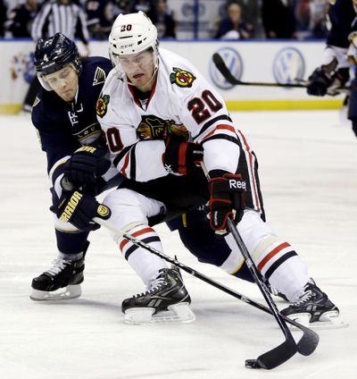 Chicago’s Brandon Saad (20) handles the puck in Chicago’s win. (Associated Press)