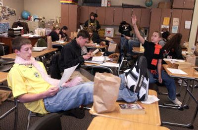 
Joe Buchanan works on solving a Christmas riddle Thursday at West Valley High School.  Students should have been on their first day of winter break, but construction delays in September forced the district to start school two days late. 
 (J. BART RAYNIAK / The Spokesman-Review)
