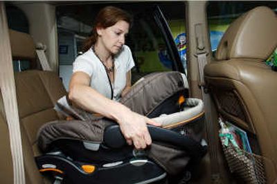 
Administrator Nicole M. Nason of the National Highway Traffic Safety Administration installs a car seat during Child Passenger Safety Technician training earlier this year. Proper installation of child safety seats is paramount in keeping children safe while traveling in automobiles.File PRN
 (File PRN / The Spokesman-Review)