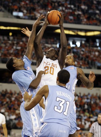 Texas forward Alexis Wangmene goes up for a shot in the first half of the Longhorns’ 103-90 win over No.10 North Carolina. (Associated Press)