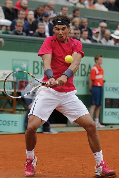 Rafael Nadal of Spain returns against Juan Monaco of Argentina. (Associated Press)