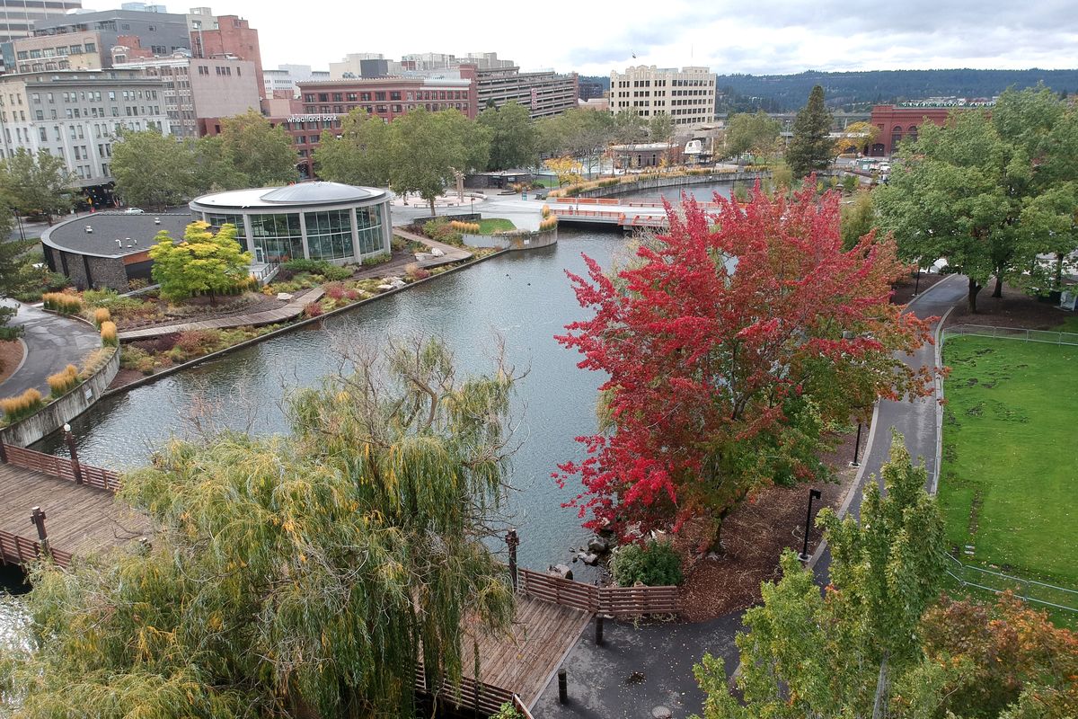 Present day: Trees, trails and turf of Riverfront Park now cover the area where the Railway Mail Terminal once sat on the Spokane River bank until 1973, when it was demolished for Expo ’74. The building, partly built on pilings in the river, was abandoned in 1960 in favor of new mail facility on Trent Avenue and Cincinnati because mail shipping was moving to trucks instead of trains. The Railway Mail Service was the dominant mail mover from 1870s until the 1950s, according to USPS.com.  (Jesse Tinsley/THE SPOKESMAN-REVIEW)