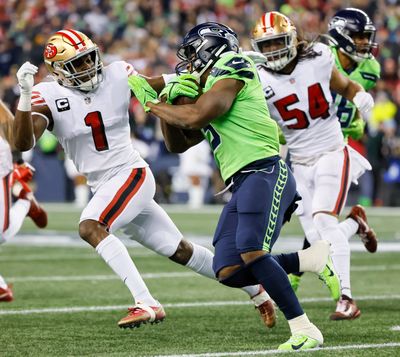 Seattle Seahawks running back Kenneth Walker III carries the ball against the San Francisco 49ers on Thursday at Lumen Field in Seattle.  (Tribune News Service)