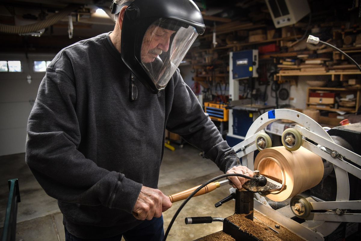 Ron Valley turns a piece of wood on a lathe while making a urn in his South Hill workshop, Wednesday, Oct. 30, 2019. (Dan Pelle / The Spokesman-Review)