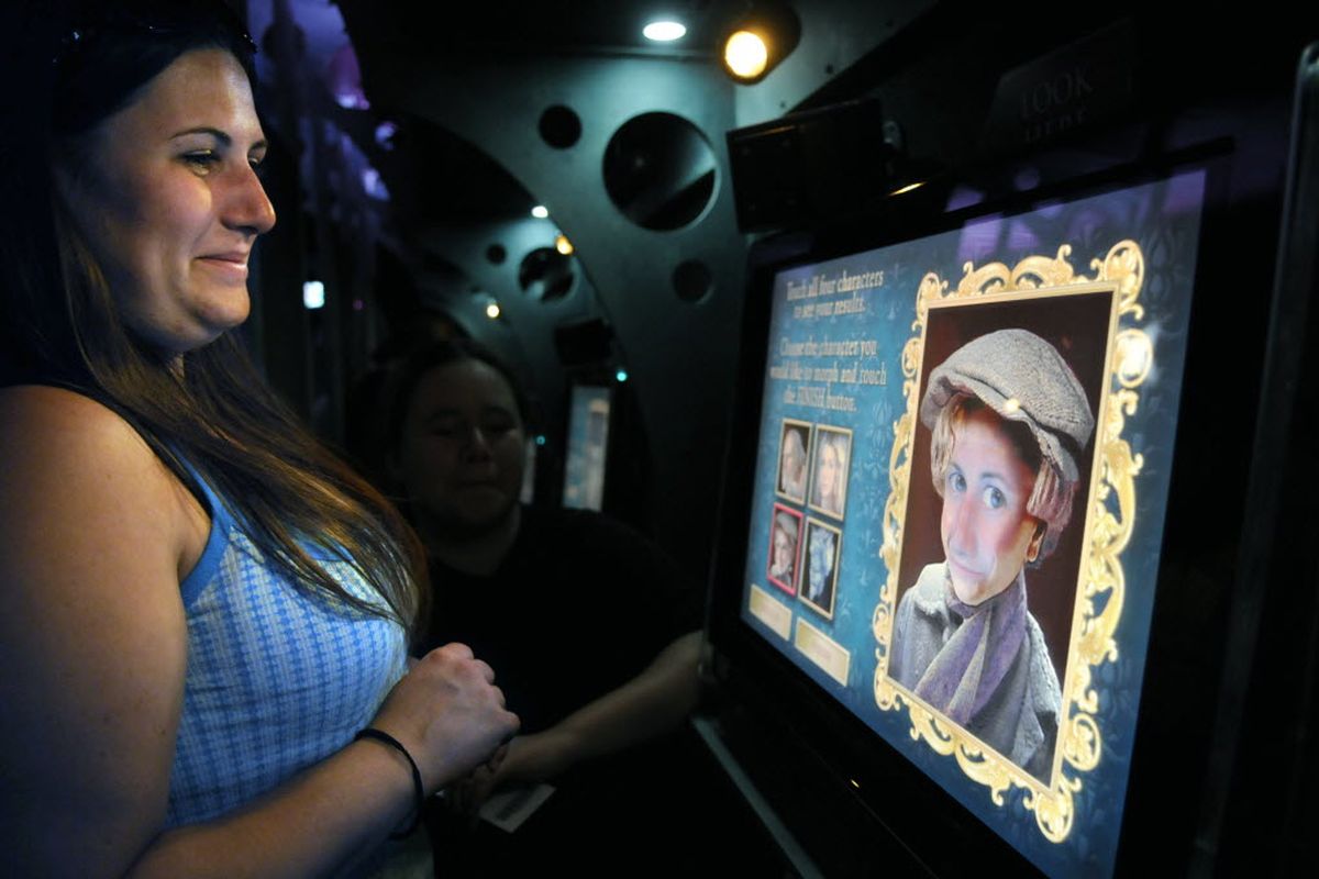 Felicia Baumgarden, 23 of Spokane, watches her face morph in to the face of Tiny Tim on July 7, 2009, as she participates in an interactive display of Disney