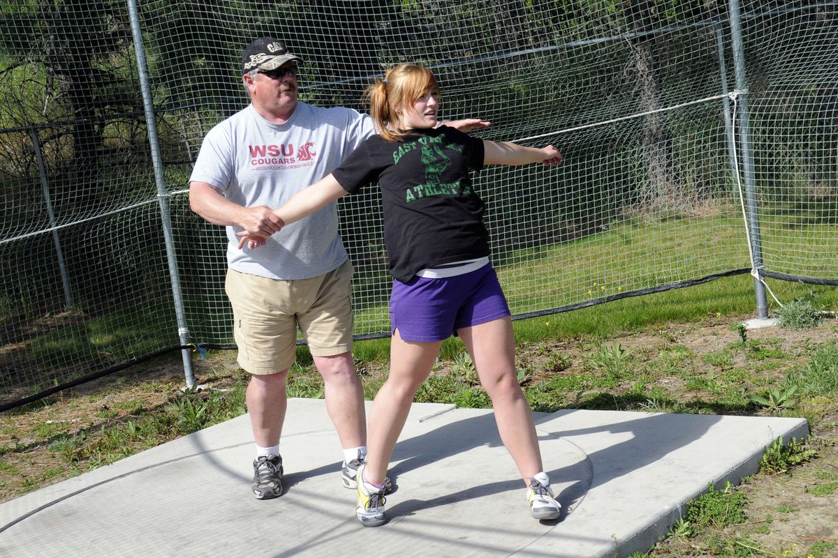 “This is where you need to be,” East Valley assistant track coach and throws coach Chuck Dunning tells 3A regional discus qualifier Ashley Reynolds, during practice Wednesday. Reynolds has also qualified in the hammer throw.