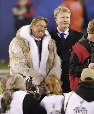 Joe Namath, left, and Phil Simms stand at midfield for the coin toss before Super Bowl XLVIII on Sunday. (Associated Press)