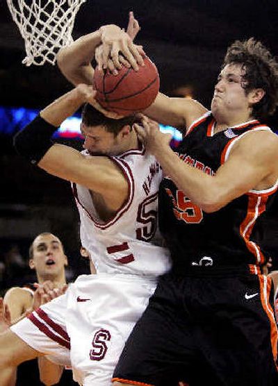 
Stanford's Matt Haryasz, left, battles with Princeton's Noah Savage during Stanford's 58-34 win on Wednesday.
 (Associated Press / The Spokesman-Review)