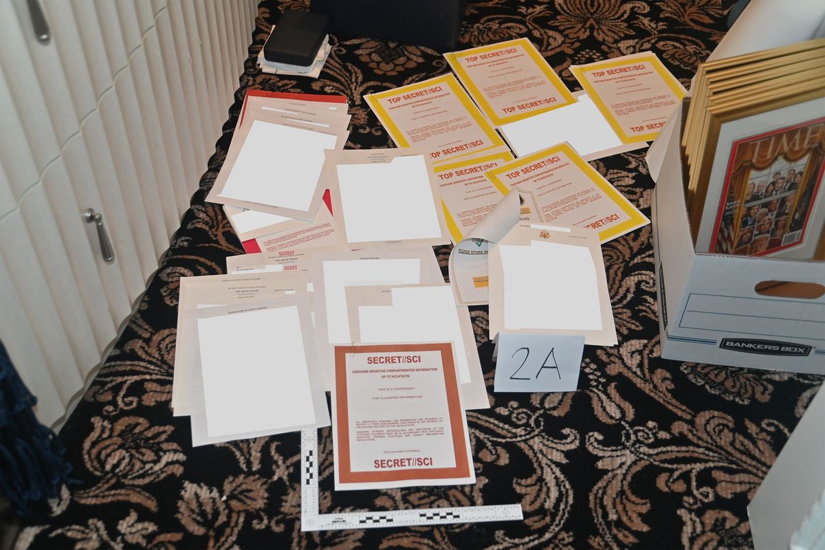 Top Secret documents (redacted by the Justice Department) are show scattered on the floor after they were found by the FBI during a raid on Mar-a-Lago and released by the Department of Justice in court documents, Aug. 30, 2022, in West Palm Beach, Florida.   (U.S. Department of Justice/Planet Pix via ZUMA Press Wire/TNS)