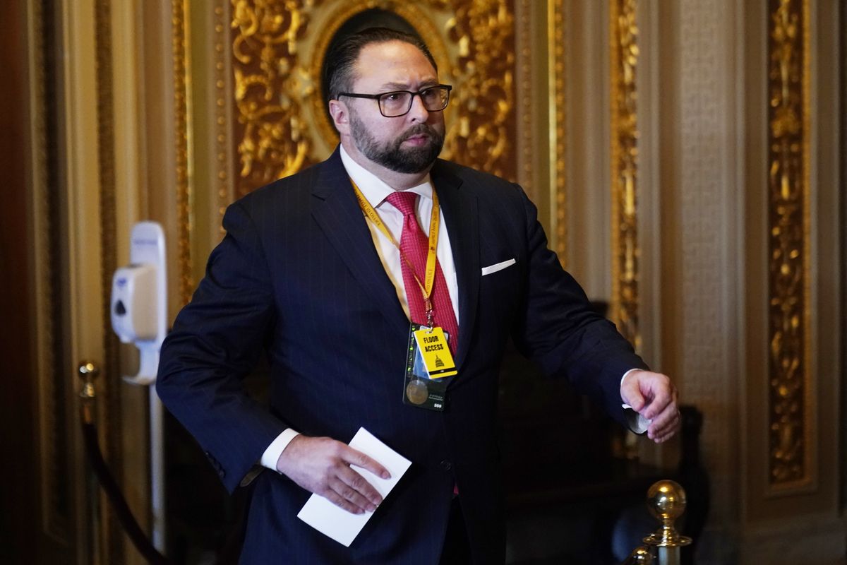 FILE – Jason Miller, senior adviser to the Trump 2020 re-election campaign, walks in the Capitol during the second impeachment trial of former President Donald Trump in the Senate, at the Capitol in Washington, on Feb. 9, 2021. A committee investigating the Jan. 6 Capitol insurrection has issued subpoenas to six associates of former President Donald Trump, including Miller, who were involved in his efforts to overturn his defeat in the 2020 election, further escalating the panel’s probe into the origins of the violent attack.  (Andrew Harnik)