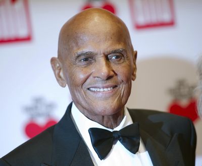 this Dec. 6, 2014,  photo, Harry Belafonte arrives at the charity gala Ein Herz fuer Kinder (A heart for children) in Berlin. Belafonte will celebrate his 90th with a new musical project. When Colors Come Together ... The Legacy of Harry Belafonte,” will feature a children’s choir singing one of his famous songs, “Island in the Sun,” an an effort to promote racial harmony. (Steffi Loos / Associated Press)