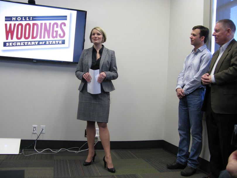 Idaho Rep. Holli Woodings, D-Boise, announces she'll run for Idaho Secretary of State; at right are her husband Ryan and Democratic candidate for governor A.J. Balukoff (Betsy Russell)