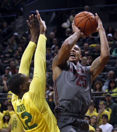 Washington State's DaVonte Lacy shoots for two of his 19 points in Sunday's game against Oregon.
 (Chris Pietsch / Fr24134 Ap)