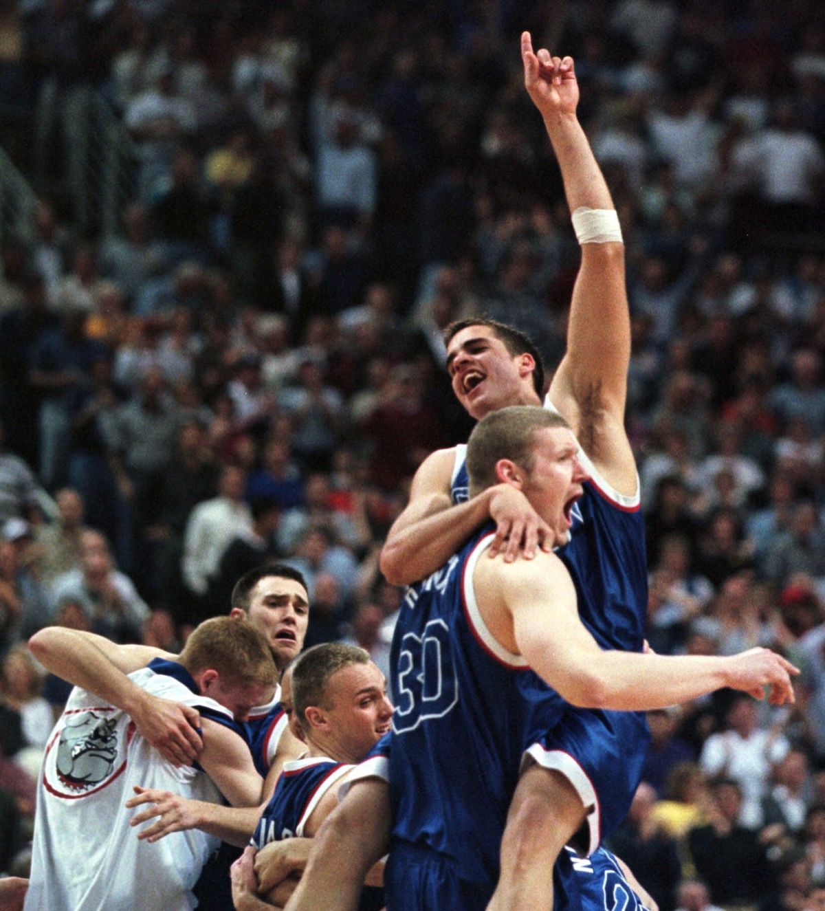 ABOVE: Rack the halls of your brain for the answer to question No. 2 about whose missed shot let to the celebration above in 1999. (Associated Press)