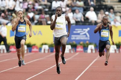 Usain Bolt, center, already holds the world 100-meter record and could challenge at 200. (Associated Press / The Spokesman-Review)