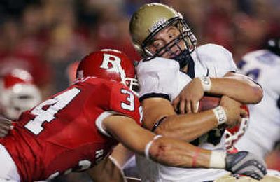 
Navy fullback Eric Kettani is stopped by Rutgers linebacker Kevin Malast.Associated Press
 (Associated Press / The Spokesman-Review)